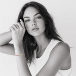 Model wearing 18k gold Morse code bracelet on colorful nylon cord — personalized gift for her birthday or friendship